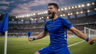 لاعب كرة قدم من نادي الكرامة يحتفل بتسجيل هدف في الدوري السوري الممتاز.